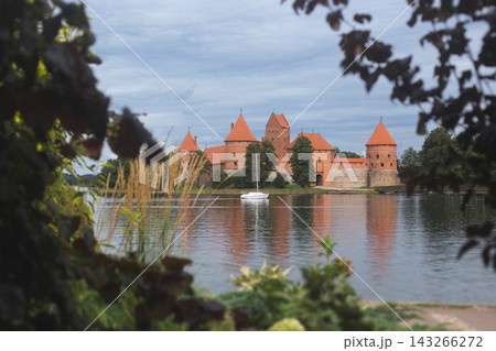 Trakai Island Castle reflected in Lake Galve under a cloudy sky Trakai Island Castle reflected in Lake Galve under a cloudy sky 143266272