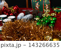Assorted Christmas Ornaments and Golden Tinsel 143266635