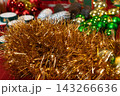 Golden Tinsel and Colorful Christmas Ornaments 143266636