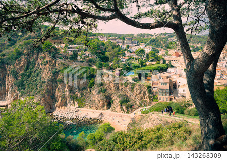 Rocky cove and cliffside coastline in Tossa de Mar on Costa Brava. Mediterranean destination for beach vacations scenic hiking and coastal tourism Rocky cove and cliffside coastline in Tossa de Mar on Costa Brava. Mediterranean destination for beach vacations scenic hiking and coastal tourism 143268309
