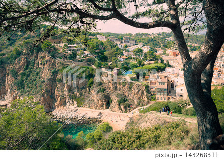 Coastal hiking destination near Tossa de Mar on Costa Brava coast. Hidden Mediterranean beach with turquoise water scenic cliffs eco tourism trails and outdoor adventure atmosphere 143268311