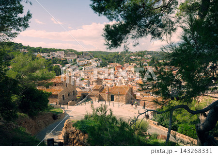 Medieval fortress walls near Tossa de Mar beach on Costa Brava in Spain. Historic Mediterranean destination for seaside vacations and cultural tourism 143268331
