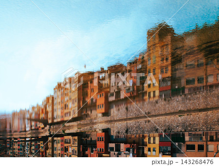 Abstract reflection of colorful Girona riverside houses in Onyar river Spain. Artistic urban background for travel editorials creative tourism design and modern city concepts 143268476