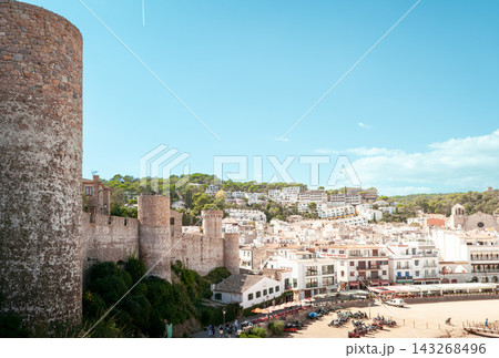 Vila Vella fortress and Tossa de Mar beach on Costa Brava in Spain. Mediterranean resort destination for seaside vacations cultural tourism and coastal travel Vila Vella fortress and Tossa de Mar beach on Costa Brava in Spain. Mediterranean resort destination for seaside vacations cultural tourism and coastal travel 143268496