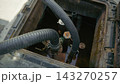 Pipes go to fuel during refueling from tanker truck to gas station 143270257