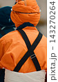 Indian man in orange uniform and turban prays during Vaisakhi 143270264