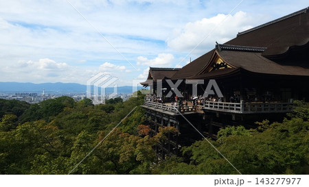 Kiyomizu-dera wooden stage surrounded by lush green forest and Kyoto city view in Japan Kiyomizu-dera wooden stage surrounded by lush green forest and Kyoto city view in Japan 143277977