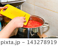 Cooking tomato sauce in big cooking pot 143278919