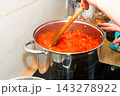 Cooking tomato sauce in big cooking pot 143278922