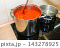 Cooking tomato sauce in big cooking pot 143278925
