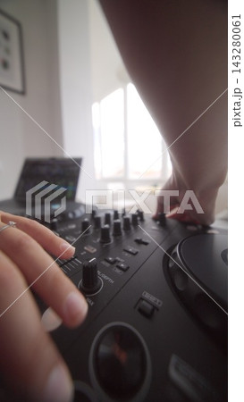 DJ organizes devices and cables for live internet transmission DJ organizes devices and cables for live internet transmission 143280061