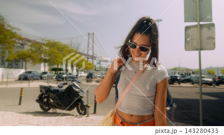Young individual strolling with accessories and calm demeanor Young individual strolling with accessories and calm demeanor 143280433