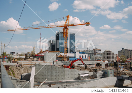 Construction site with tower crane and modern city skyline in Yekaterinburg Russia Construction site with tower crane and modern city skyline in Yekaterinburg Russia 143281463