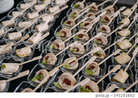 Elegant catering appetizers and finger food served at a reception Elegant catering appetizers and finger food served at a reception 143281602