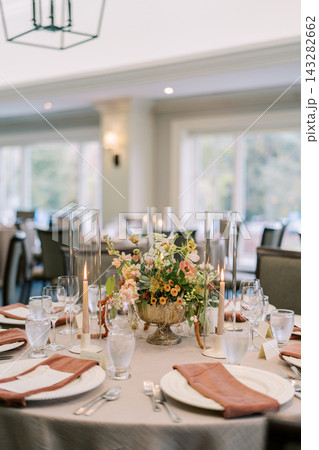 Elegant wedding reception table with floral centerpiece Elegant wedding reception table with floral centerpiece 143282662
