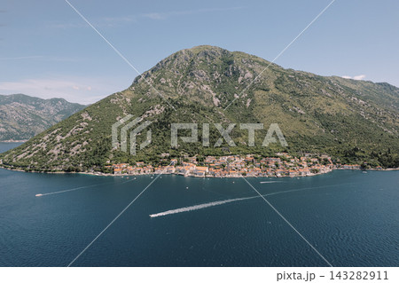 Aerial view of Perast coastal town and mountain in Montenegro Aerial view of Perast coastal town and mountain in Montenegro 143282911