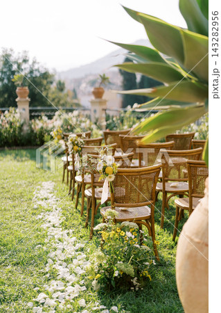 Elegant outdoor wedding ceremony setup in Taormina Elegant outdoor wedding ceremony setup in Taormina 143282956