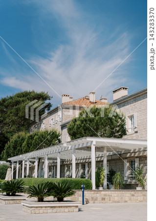 Stone building with pergola and lush greenery at Marina Lazure Montenegro Stone building with pergola and lush greenery at Marina Lazure Montenegro 143283370