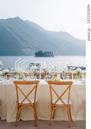 Relaxed destination wedding with soft sunset lighting and floral accents Relaxed destination wedding with soft sunset lighting and floral accents 143283804