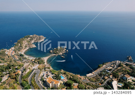 Aerial view of Isola Bella and coastline in Taormina Sicily Aerial view of Isola Bella and coastline in Taormina Sicily 143284095