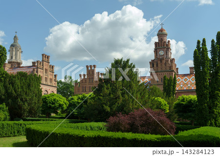 Chernivtsi National University palace and clock tower with beautiful formal garden. Chernivtsi National University palace and clock tower with beautiful formal garden. 143284123