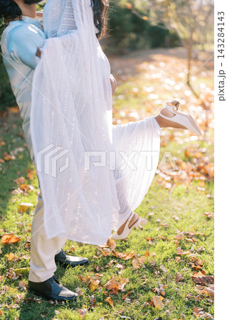 Romantic Outdoor Moment with Couple in Traditional Attire Romantic Outdoor Moment with Couple in Traditional Attire 143284143