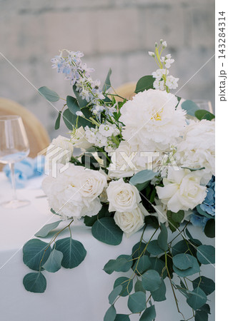 Elegant white peonies and roses wedding floral arrangement Elegant white peonies and roses wedding floral arrangement 143284314