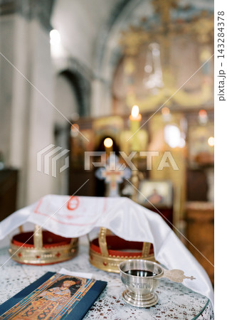 Orthodox wedding crowns and ritual items in church Orthodox wedding crowns and ritual items in church 143284378