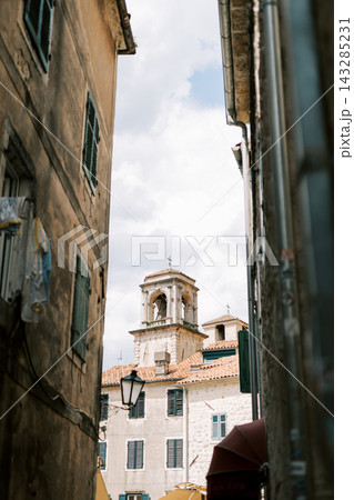 Mediterranean street scene. Charming alley featuring hanging laundry and historic ambiance Mediterranean street scene. Charming alley featuring hanging laundry and historic ambiance 143285231