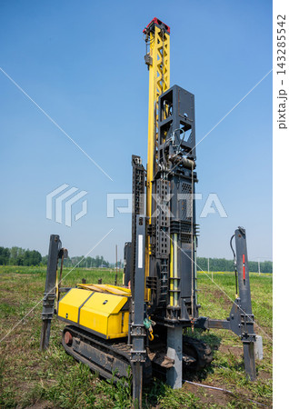 Diesel hammer drives concrete piles for a country house. Diesel hammer drives concrete piles for a country house. 143285542