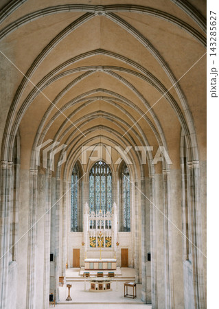 Historic Gothic cathedral interior showcasing elaborate tracery and tranquil spiritual ambiance Historic Gothic cathedral interior showcasing elaborate tracery and tranquil spiritual ambiance 143285627