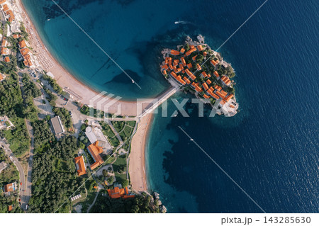 Vivid aerial view of coast. Captivating aerial footage showcasing beaches and harbor scenes 143285630