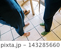 Casual And Natural Moment Captured Of Two Persons In Sunny Domestic Kitchen Setting 143285660