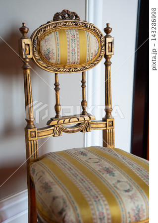 Gilded neoclassical chair with floral silk upholstery Gilded neoclassical chair with floral silk upholstery 143286998