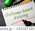 Outcome-based pricing phrase written in a notebook for value-driven business strategy. 143287140