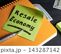 Cash and handwritten resale economy note show growth in secondhand commerce. 143287142