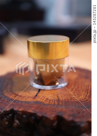 Wooden Surface with Metallic Knob Close-up 143287281