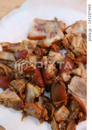 Crispy Pork Belly Pieces on White Paper Crispy Pork Belly Pieces on White Paper 143287469