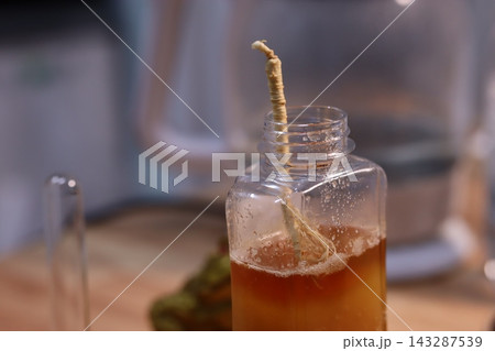 Ginseng Infusion in Glass Bottle Ginseng Infusion in Glass Bottle 143287539