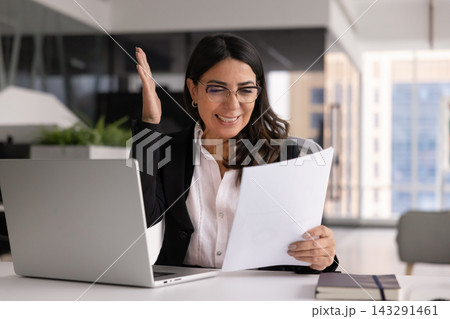 Businesswoman checking document, celebrates achievement and success 143291461