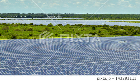 Aerial view of big sustainable electric power plant with many rows of solar photovoltaic panels for producing clean electrical energy. Renewable electricity with zero emission concept 143293113