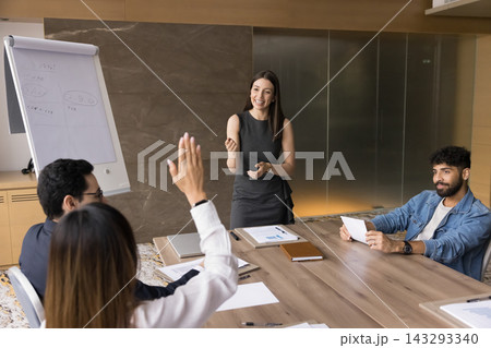 Female business trainer ask questions to motivated multiethnic conference participants 143293340