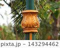 Gold carved pillar decoration on green post 143294462
