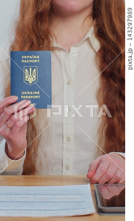 Vertical video. Ukranian embassy officer showing Ukrainian passport immigrant, student visa approval, work visa, citizenship. Visa Application online form immigration concept. Visa approval. Vertical video. Ukranian embassy officer showing Ukrainian passport immigrant, student visa approval, work visa, citizenship. Visa Application online form immigration concept. Visa approval. 143297989