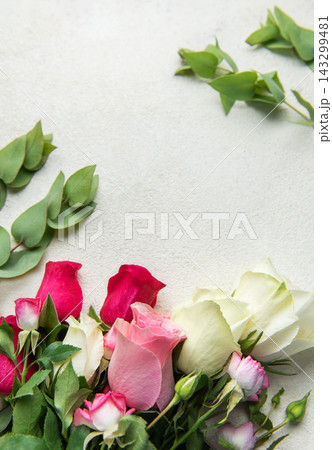 Roses and eucalyptus creating floral background with copy space Roses and eucalyptus creating floral background with copy space 143299481