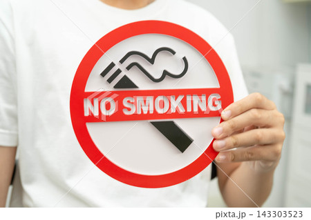 Male holding a no smoking sign. Male holding a no smoking sign. 143303523