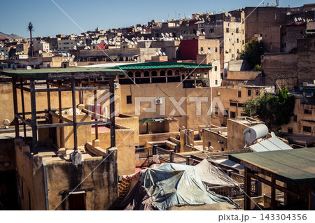 Panoramic view over the rooftops and historic skyline of Fes Panoramic view over the rooftops and historic skyline of Fes 143304356