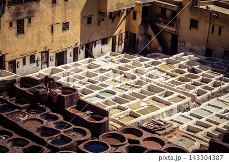 Elevated view of dye vats at the historic Chouara Tannery in Fes 143304387