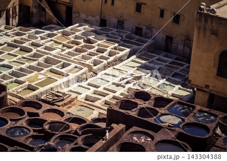 Elevated view of dye vats at the historic Chouara Tannery in Fes 143304388