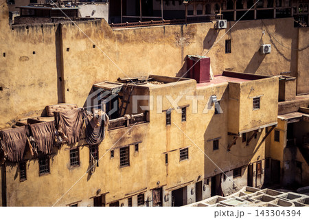 Elevated view of dye vats at the historic Chouara Tannery in Fes 143304394